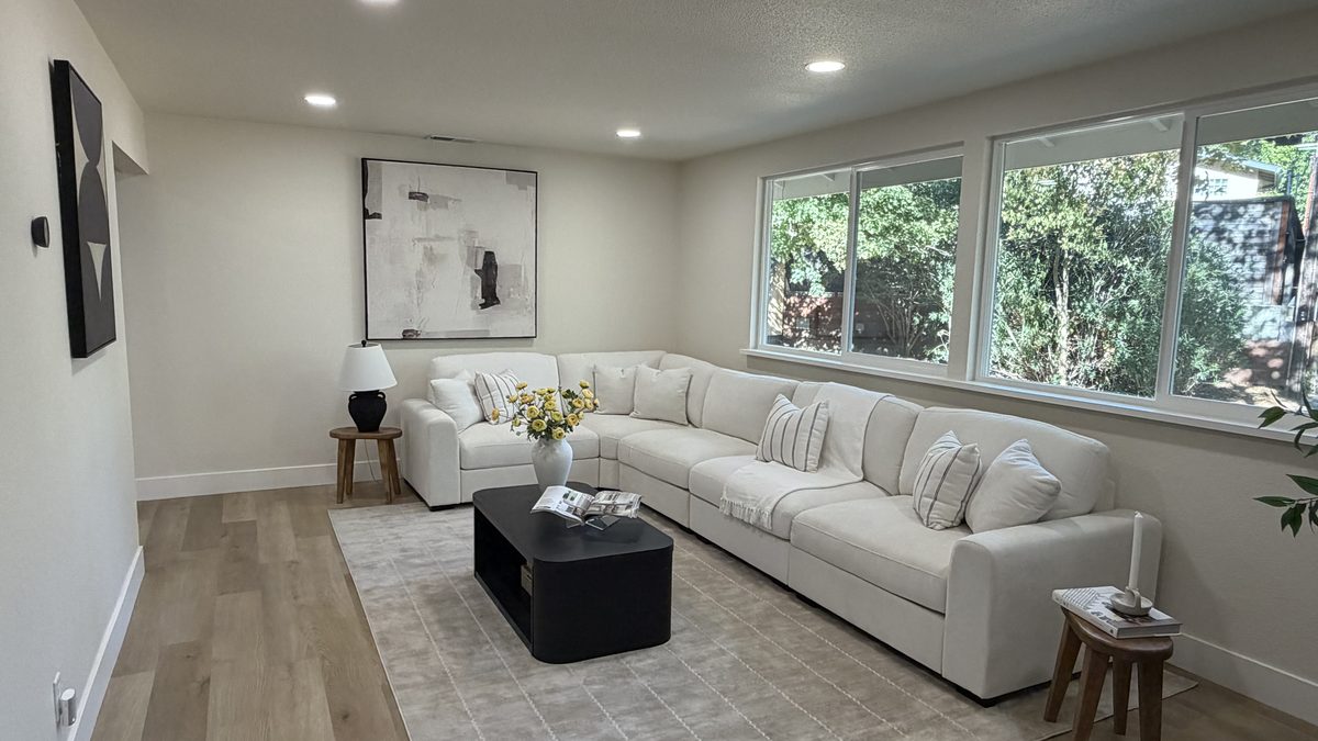 Living room after a whole-house remodel by RNDLine Construction